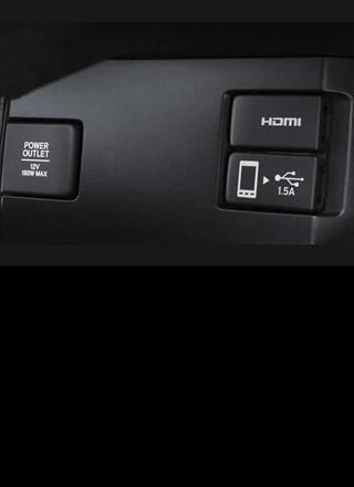 A USB port marked with handphone icon supports Apple CarPlay™ (comparable  with some smartphones)