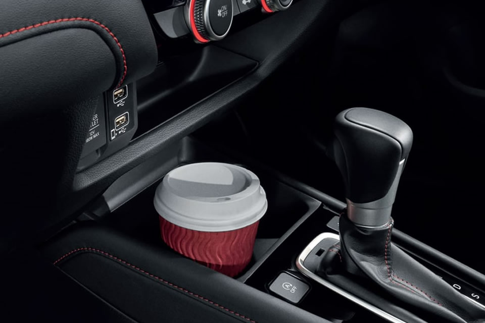 Bevarage cup holder within easy reach for front passenger